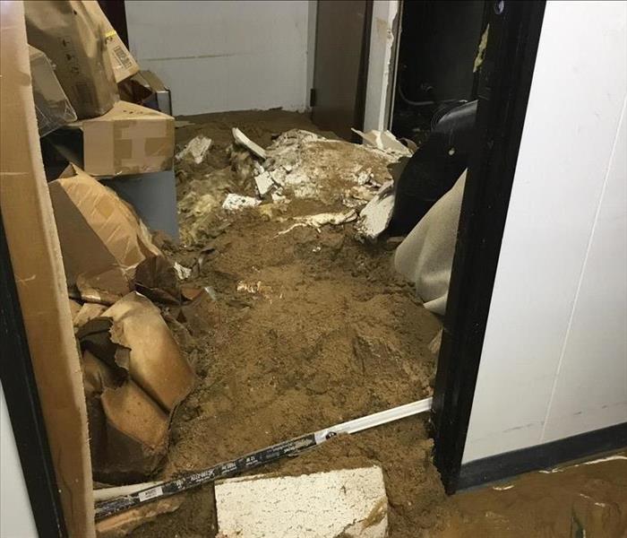 Storage closet affected by mud