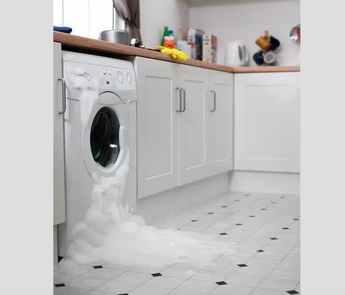 Washing machine overflowing with bubbles